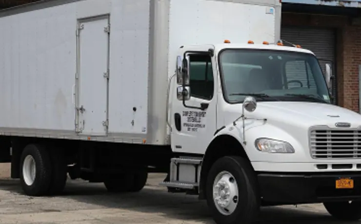 Straight box truck at a loading bay