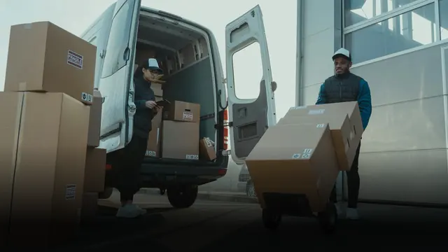 Boxes being loaded from a van at a dock
